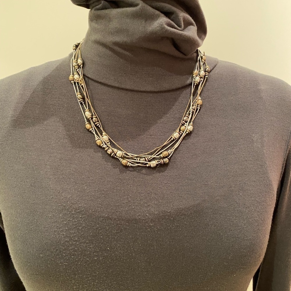 Six strand bronze, silver and brass necklace